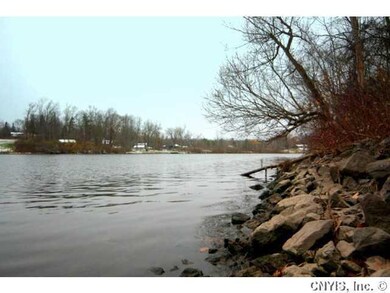 Exterior Front. From the riverbank at the property