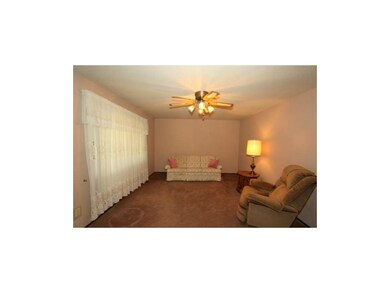 THIS IS A SPACIOUS LIVING ROOM WITH NEW PAINT!