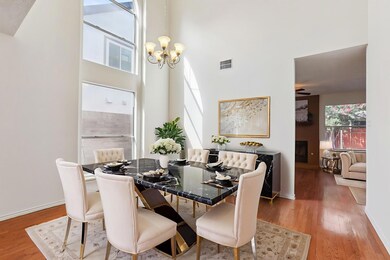 Dining space with a chandelier, light wood finish
