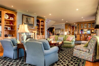Living room with recessed lighting, built in bookc