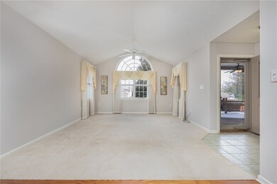 Living Area off of entry way. Striking arched wind