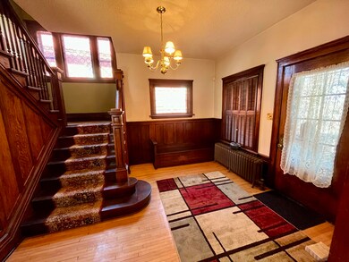 Beautiful stairway by entry of home