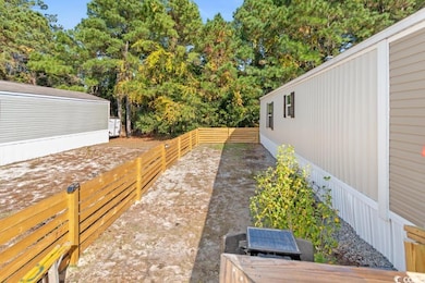 View of fenced backyard