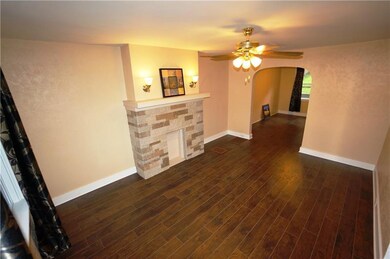 lviing room w sconce lights, decorative FP and cei