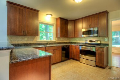 Spacious kitchen with granite and stainless steel