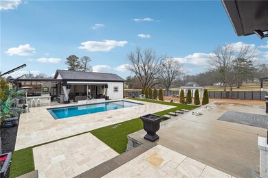 View of swimming pool with a fenced in pool, a pat