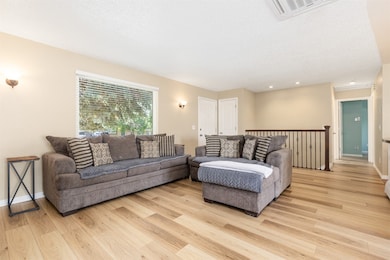 Living area featuring light wood-style flooring, r