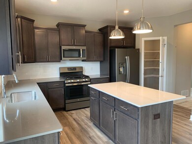 An awe-inspiring kitchen with a beautiful styled island is the perfect place for friends and family to gather around for years to come.