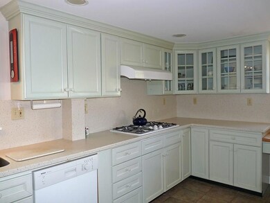 Kitchen showing corian countertops,...