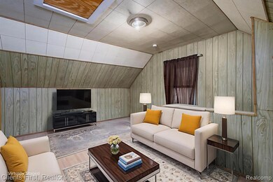 Living area with wooden walls, lofted ceiling, and wood finished floors
