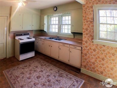 The sun streams into the kitchen area with a nice 