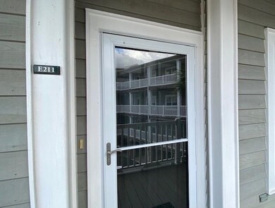 Full view storm door with retractable screen