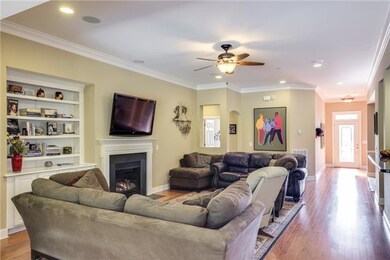 Fantastic Open Floor plan that flows with finished wood floors and soaring ceilings throughout! Great Room with fireplace and builtin bookshelves!