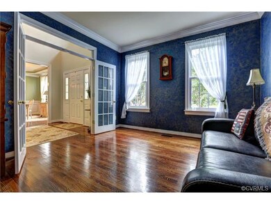 Living Room with beautiful hardwood floors, crown 