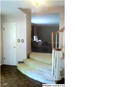 Foyer to coat closet on the left and living room a