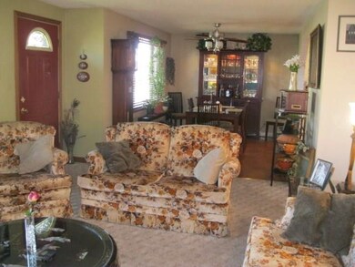 Lovely living room is wide open to the formal dini
