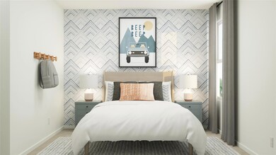 Bedroom featuring light carpet