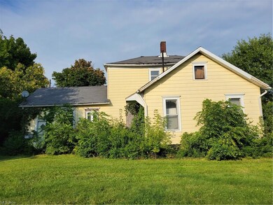 View of home's exterior featuring a lawn