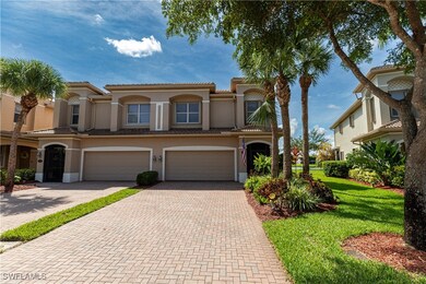View of front of house featuring driveway, stucco