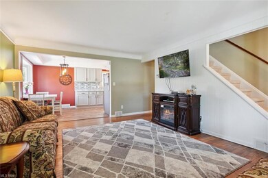 Hardwood floored living room featuring separate wa