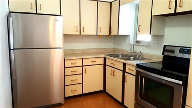 The eat-in kitchen is equipped with appliances.