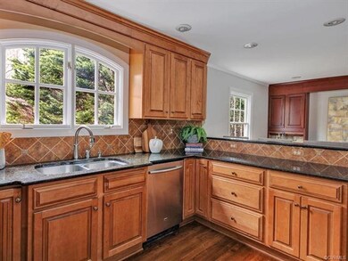 Custom cabinetry, granite countertops, tile backsp