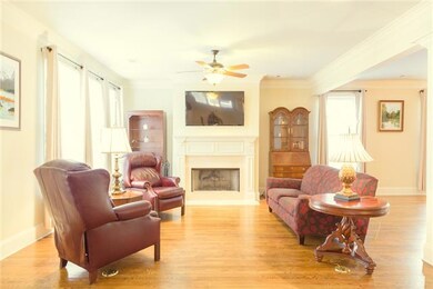 Open living area welcomes family & friends! Rich hardwoods shine and make this open space perfect for memorable festivities and cozy evenings by the gas fireplace.