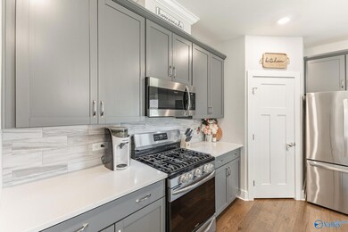Features large pantry, ample cabinets, and stainless appliances.
