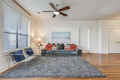 Living room featuring baseboards, visible vents, 