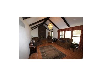 Vaulted Great Room measures 26'x14'.  Woodburning 