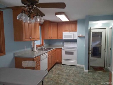 Kitchen. Featuring updated flooring, oak cabinets,