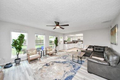This spacious living room is bright and inviting,