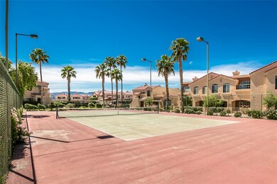 View of tennis court featuring a residential view