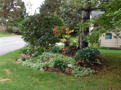 Mature landscaping surrounds this lovely home