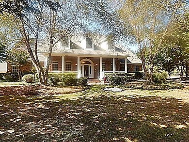 Pretty brick front porch is so inviting