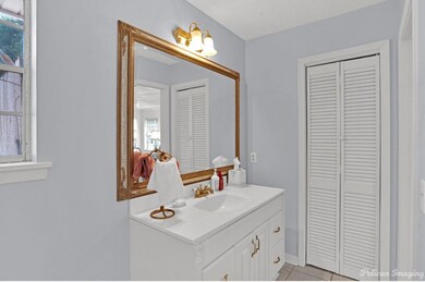 Bathroom featuring tile flooring and vanity