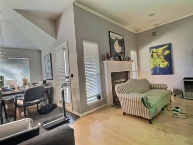 Fireplace in living room with a view of the dining