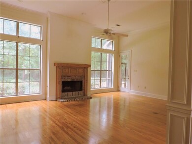 Formal Living Room overlooks back yard. Columns (c