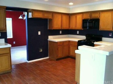 Kitchen with Tile floor, gas stove and built-in mi