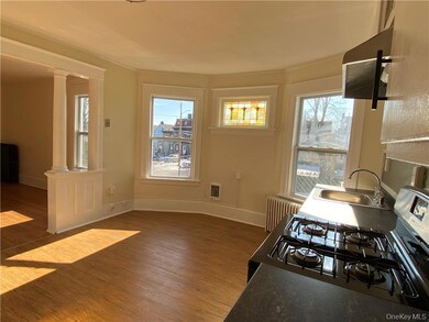 Plenty of room to add a dining table in the sunlit eat-in kitchen