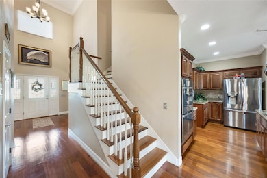 Looking at the front door from the inside of the home in the eat in kitchen area