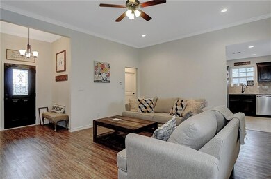Large family room leads to kitchen.  Photo is repr