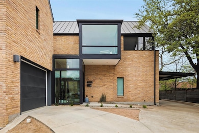 Contemporary home featuring a standing seam roof,
