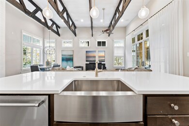 Kitchen featuring open floor plan, dishwasher, li