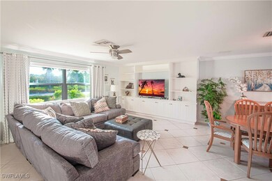 Living room with built in shelves, crown molding,