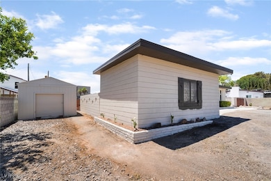View of home's exterior with a garage, an outdoor