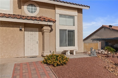 Property entrance featuring stucco siding and a ti