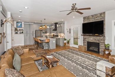 The main level living space is warm and inviting, a perfect gathering space.