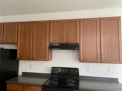 Kitchen featuring black appliances