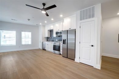 Kitchen with stainless steel appliances, a ceilin